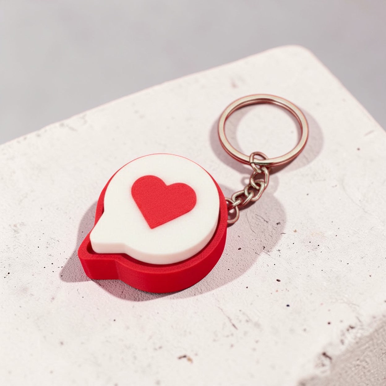 Keychain with a heart design on a wooden surface