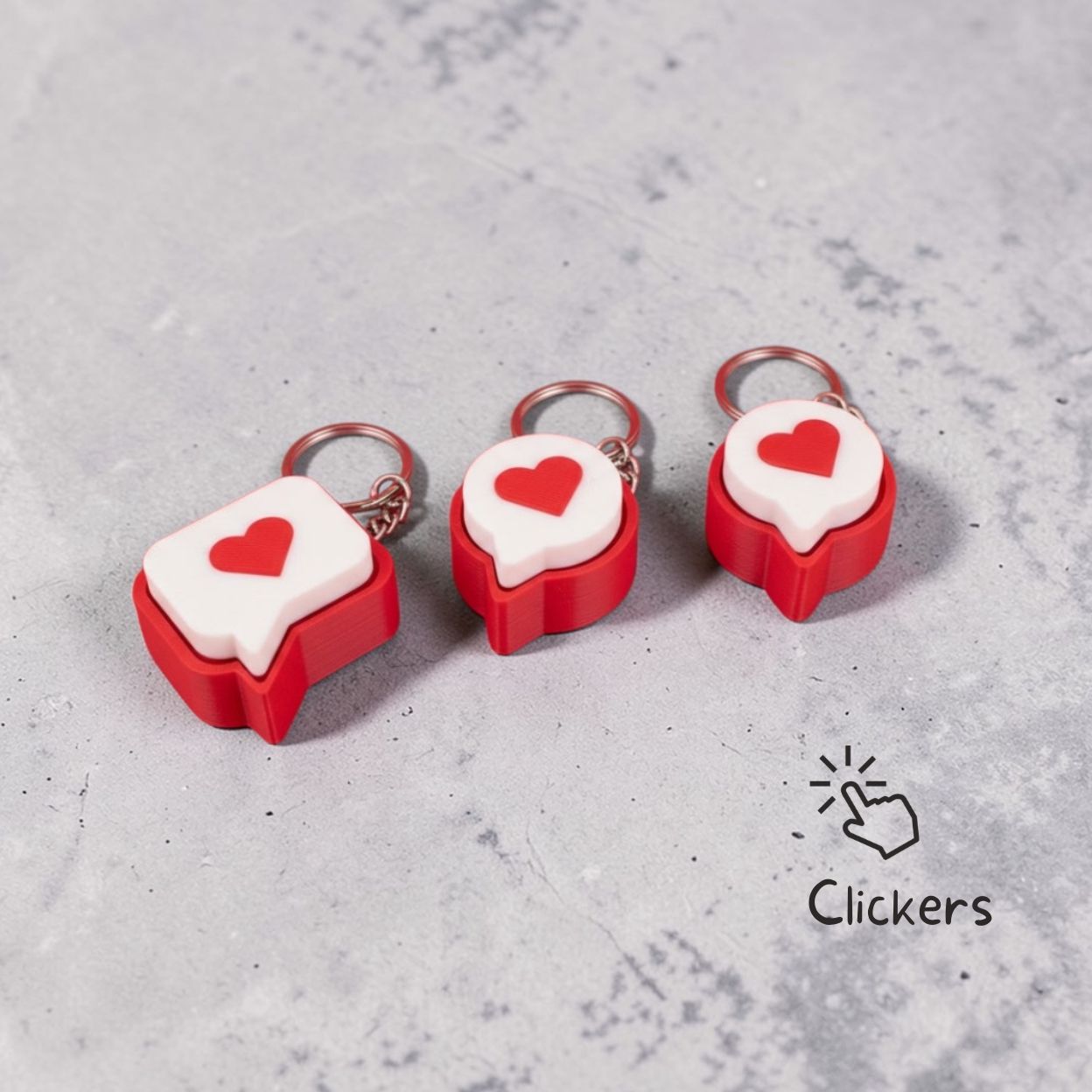 Red and white keychains shaped like cake slices with heart designs on a wooden surface.